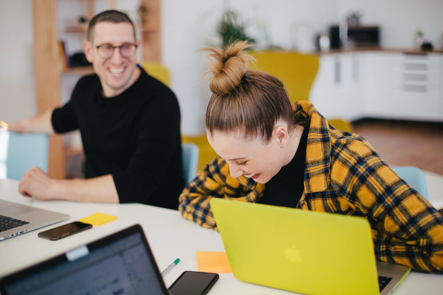 Person in office setting laughing