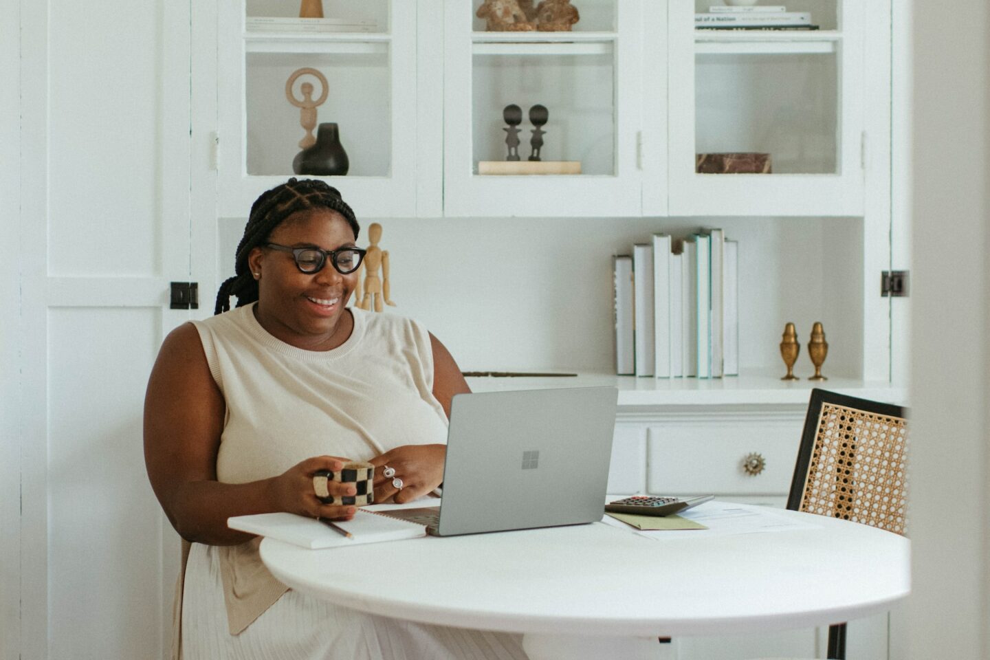 Woman sitting in front of her laptop working from home