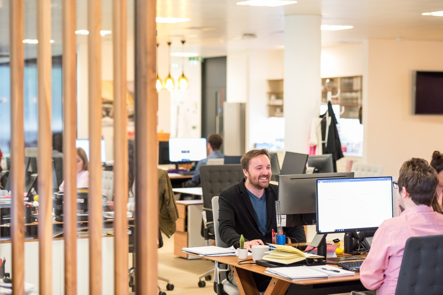 Man working at computer laughing