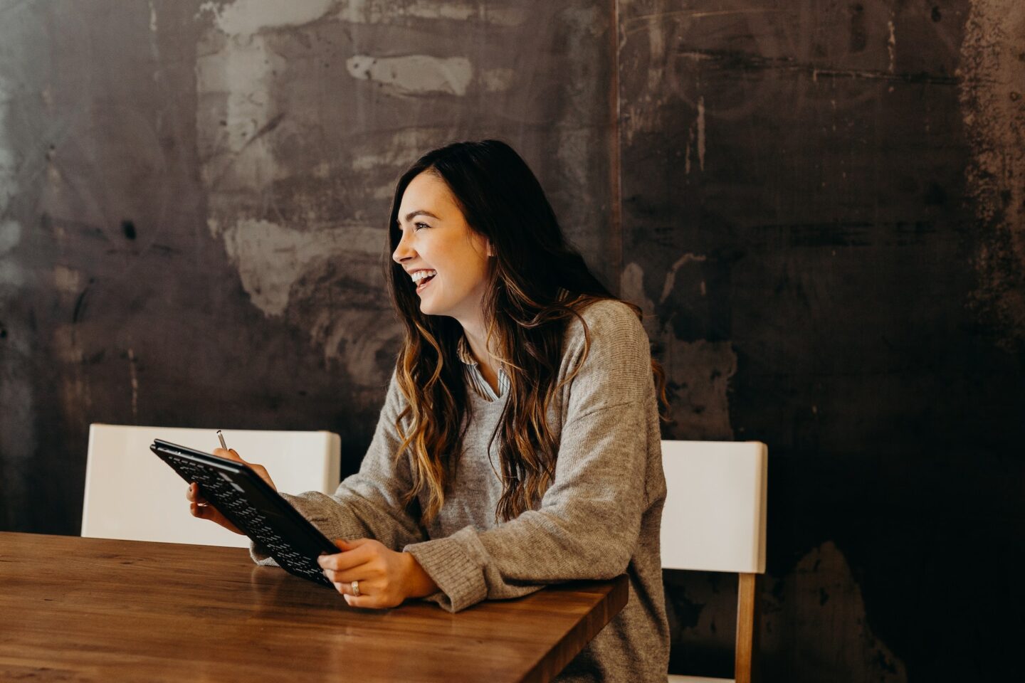 Woman at work laughing