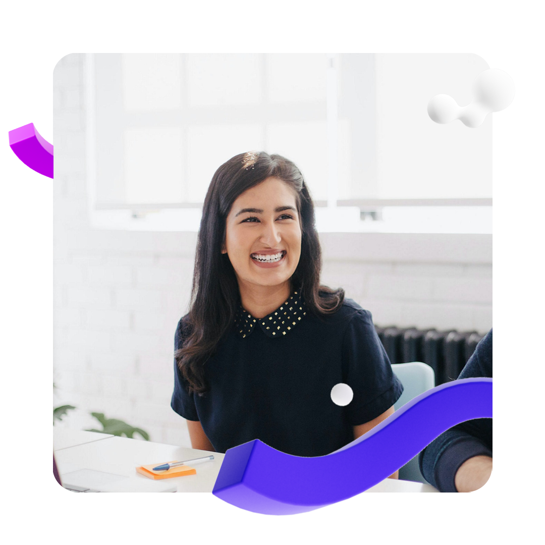 Woman laughing in office environment