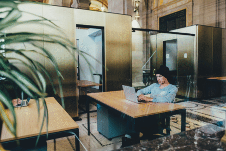 View How to Maximize Completion Rates in Your Surveys: 5 Top Tips for Market Researchers Person working at a laptop in the office